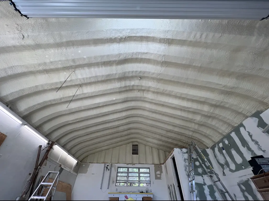 Spray polyurethane foam applied to the underside of a metal roof deck in Lilburn